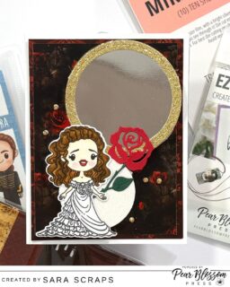This Phantom of the Opera-inspired card from @sara.scraps hides a glowing surprise that reveals itself when the lights come on! She used Pear Blossom Press EZ Lights along with our NEW Mirror Sheets to create that dramatic illuminated backdrop, perfect for capturing all the dark mystery and romance of this popular story . This card has an  unforgettable “wow” moment you don’t want to miss! This card feels like stepping right into the story. Be sure to watch the full process and reveal over on our YouTube channel! #pearblossompress #scrappboystamps #cardmaking