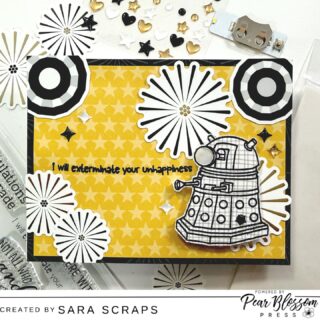 Exterminate your unhappiness! This Doctor Who–inspired interactive card created by @sara.scraps features a clean, graphic design with Pear Blossom Press light-up element that makes this Dalek’s eye extra special with the press of a button. The bold black and white details from bellablvdllc Let’s Celebrate collection against the star-filled background create the perfect stage for that glowing focal point.
Watch the full process video on our YouTube channel to see how Sara built the light-up mechanism step by step. #pearblossompress #bellablvdllc #cardmaking  #cardmakingideas