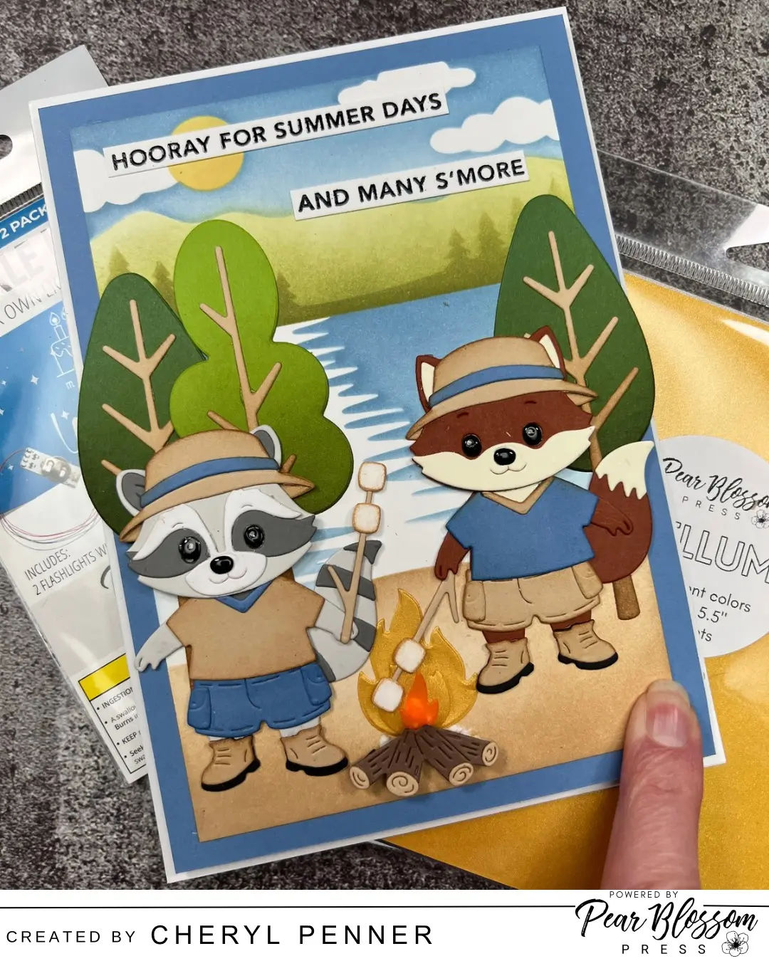 Hello, Cheryl here (aka  ArtsyIslandGirl ) sharing how to create an adorable Campfire card using Twinkle lights and coloured vellum.  I'm using The Summer Camp collection from Spellbinders to create the scene but that twinkling campfire really steals the show and takes the card to a whole new level!