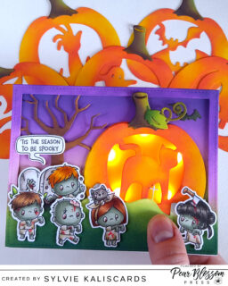 Hello crafty friends! Sylvie @kaliscards here. I'm sharing a fun interactive project today, featuring a few products from @pearblossompress. The starting point of this card is the Pumpkin carvings die set from @mamaelephant. I couldn't decide which one I wanted to light up so I found a way to use all of them, by creating interchangeable pumpkins, held by a magnet hidden with the stems. And I used my favorite @pearblossompress light, the Halo light.

Products:
Halo combo light, Neodymium magnets, Vellum translucent colors and World's best foam tape (Pear Blossom Press)
Walking zombies, Pumpkin carvings, Favor bag pumpkin and Graveyard bash (Mama Elephant)
All the spooks (Hello Bluebird stamps)

Ranger Distress Oxides: Milled lavender, Wilted violet, Villainous potion, Twisted citron, Rustic wilderness, Carved pumpkin, Ripe persimmon, Crackling campfire, Pumice stone, Weathered wood, Black soot, Walnut stain and Vintage photo

#pearblossompress #mamaelephant
#cardmaking #interactivecard