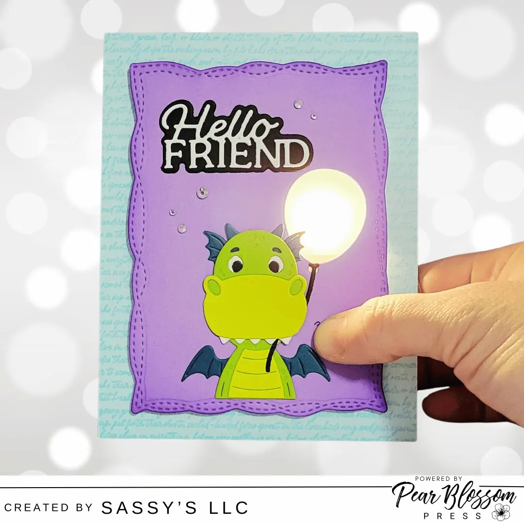 Hi Friends! Sara Lihz here from @sassysllc, and I have an adorable light-up dragon card for you today. 

This one has a unique escape hatch for the replacing the battery that is hidden between the front panel and the card base. You can check out the full tutorial over on the Pear Blossom Press YouTube channel. 

@teamspellbinders #cardmakersofinstagram #interactivecards #lightupcard #pearblossompress