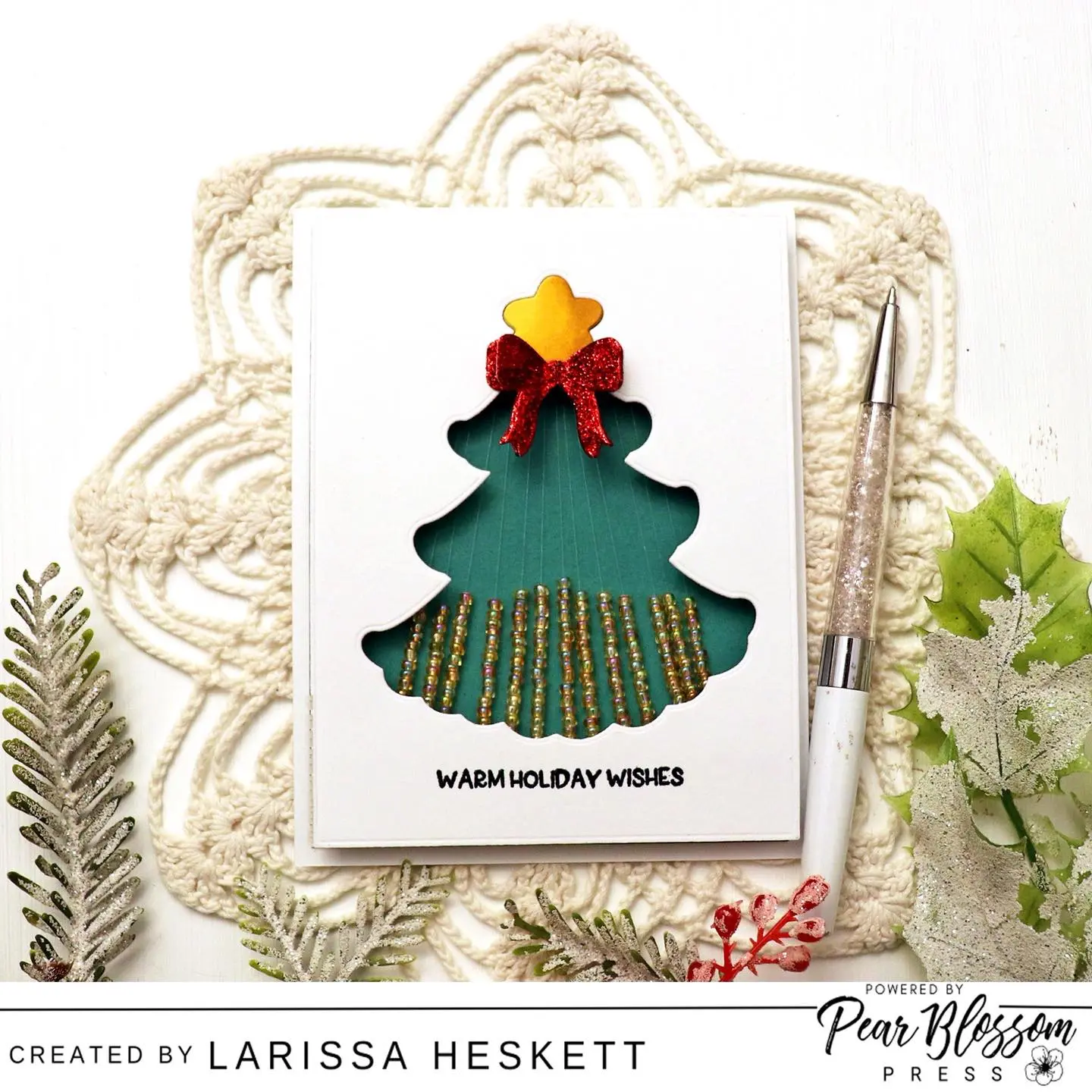 Hello Crafty Friends!! Larissa here today to share a Festive Holiday Card using the NEW Beaded Rainfall Kit!! SWOON!! I LOVE all of the different ways you can use this Kit!! I’ve paired it with some products from Trinity Stamps and I hope it INSPIRES you to create some Holiday Cards too!! Happy Crafting, Friends!! #BeadedRainfallKit #PearBlossomPress #TrinityStamps #HolidayCards #InteractiveCards