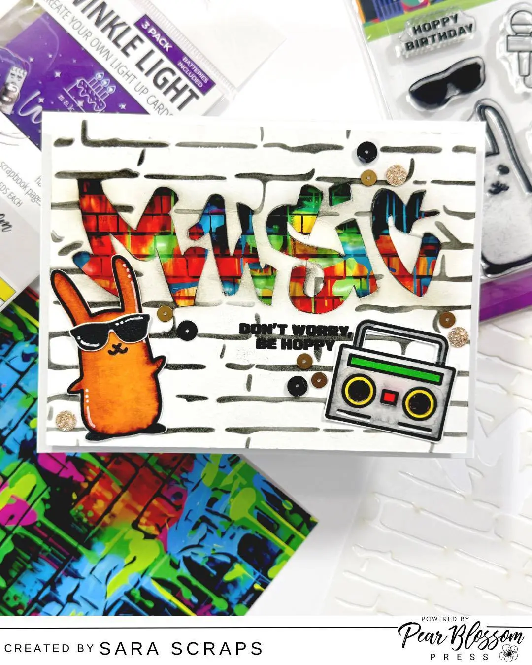 Turn up the volume and let this card ROCK! Grungy vibes, bold color, a little attitude—and a twinkling light-up element from Pear Blossom Press to bring the whole thing to life. Just press the button and watch those lights flash like a tiny concert on a card! 
Because handmade cards don’t always have to be sweet and pretty… sometimes they need to rock & roll. #cardmaking #interactivecards #papercrafting